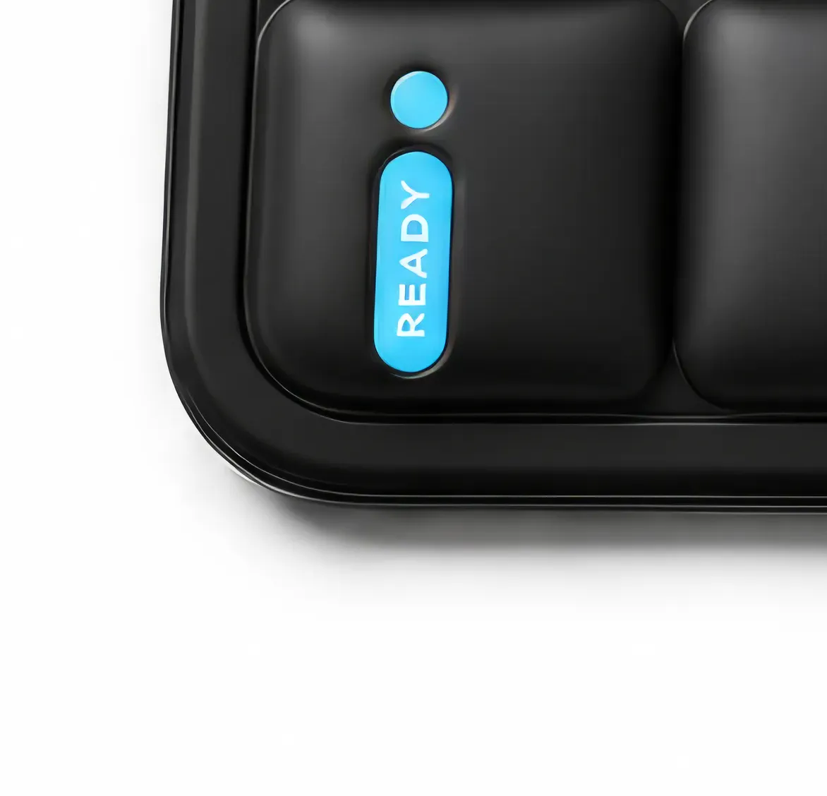 Macro close-up of the thermochromic readiness badge on Kelvin®, fading from white to ice blue
