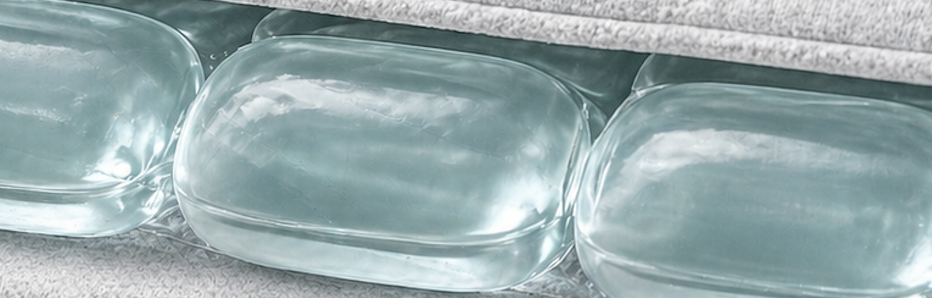 Macro view of translucent PCMx phase-change pods sealed inside the Kelvin wrap